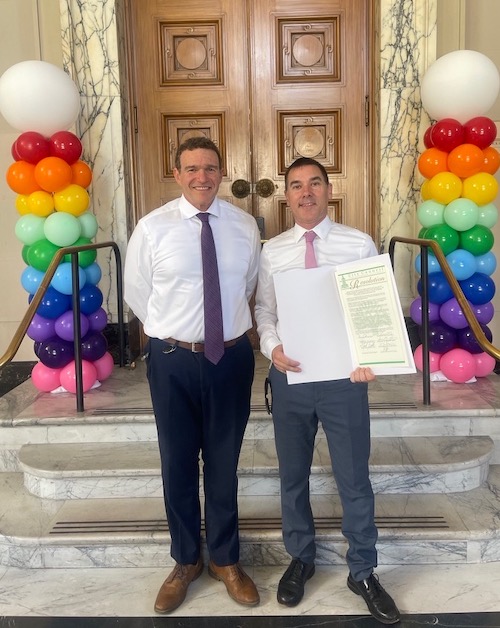 A photo of Prairieform's John Kamp with Councilmember Zac Unger, receiving the Oakland LGBTQ+ Ladership and Service Award