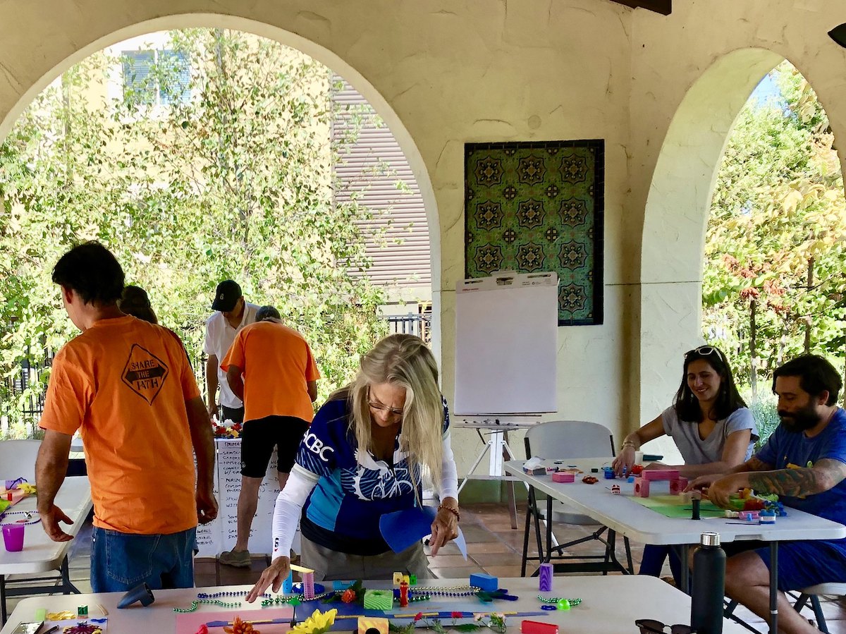 People building models with found objects of a more bikable Elysian Valley.