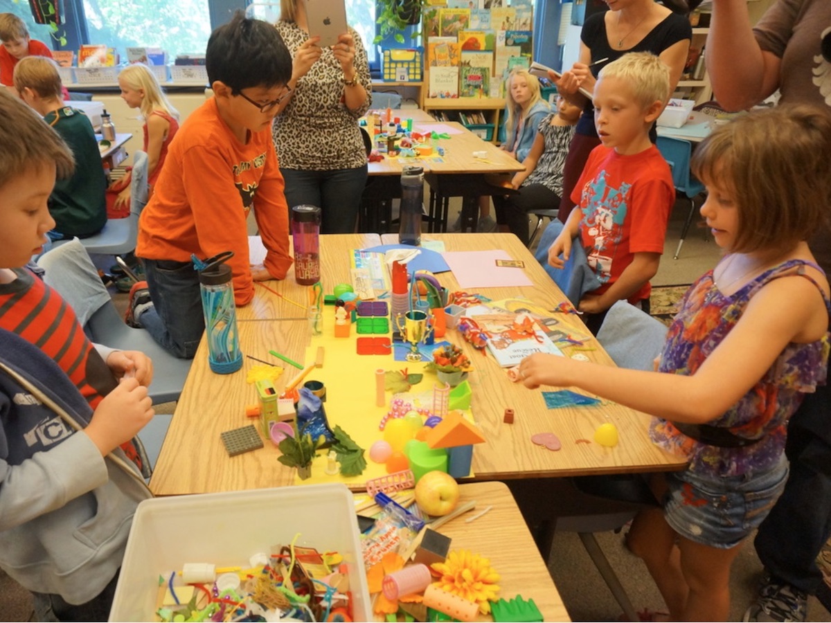 Kids building models of their ideal cities.